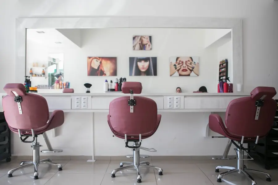 Bright beauty salon interior with styling chairs and mirrors